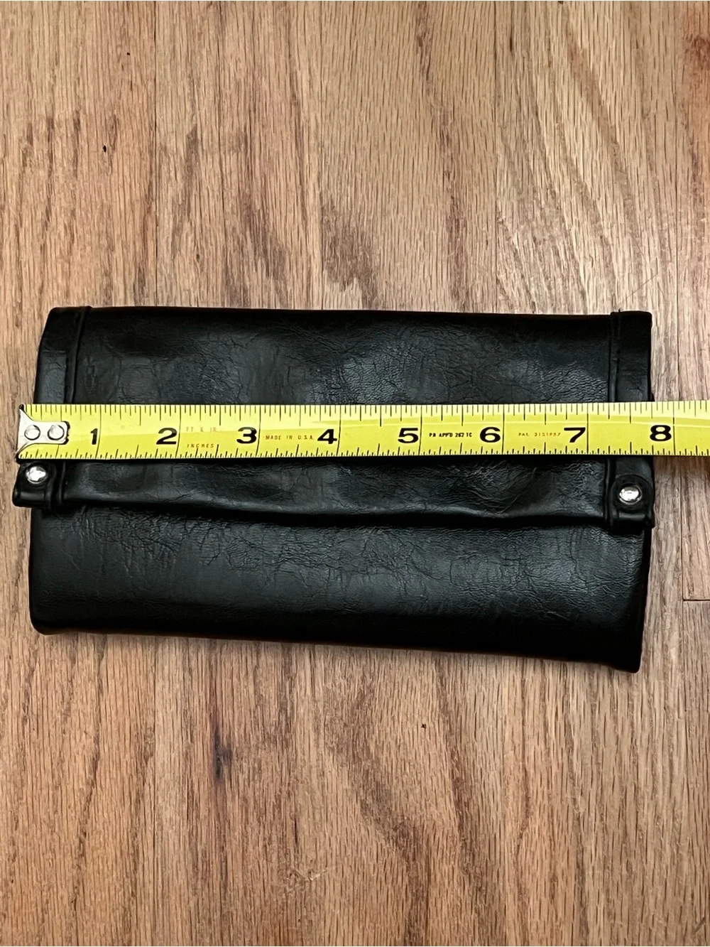 Black Fold-Over Clutch Wallet new without tags. Never used. Genuine leather